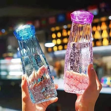 Diamond-Shaped Glass Water Bottles Featuring Geometric Design