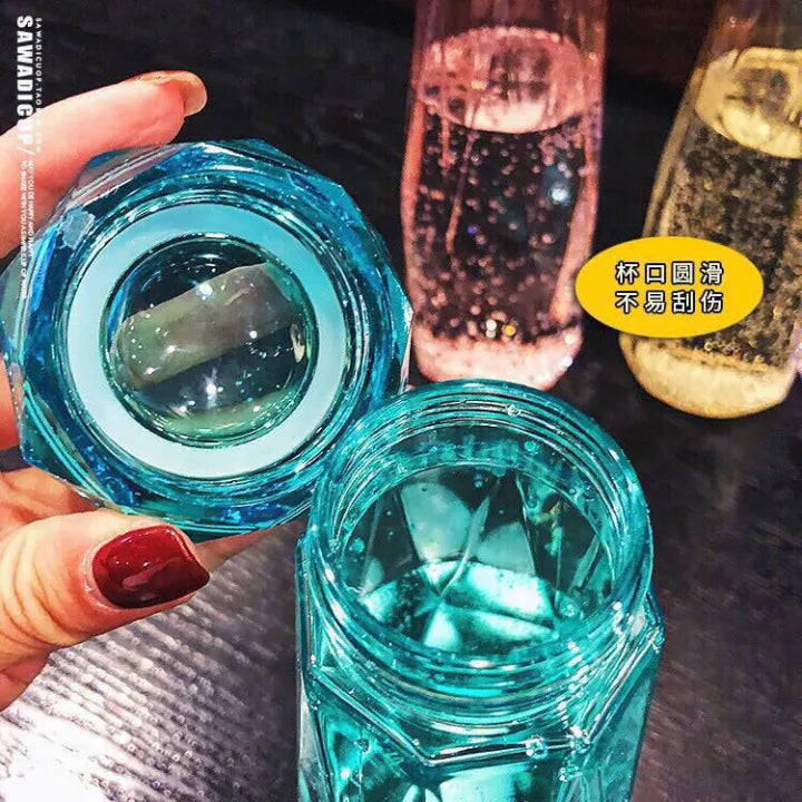Diamond-Shaped Glass Water Bottles Featuring Geometric Design
